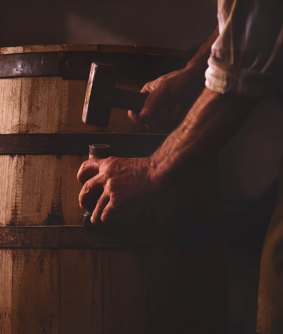 Man repairing wine barique